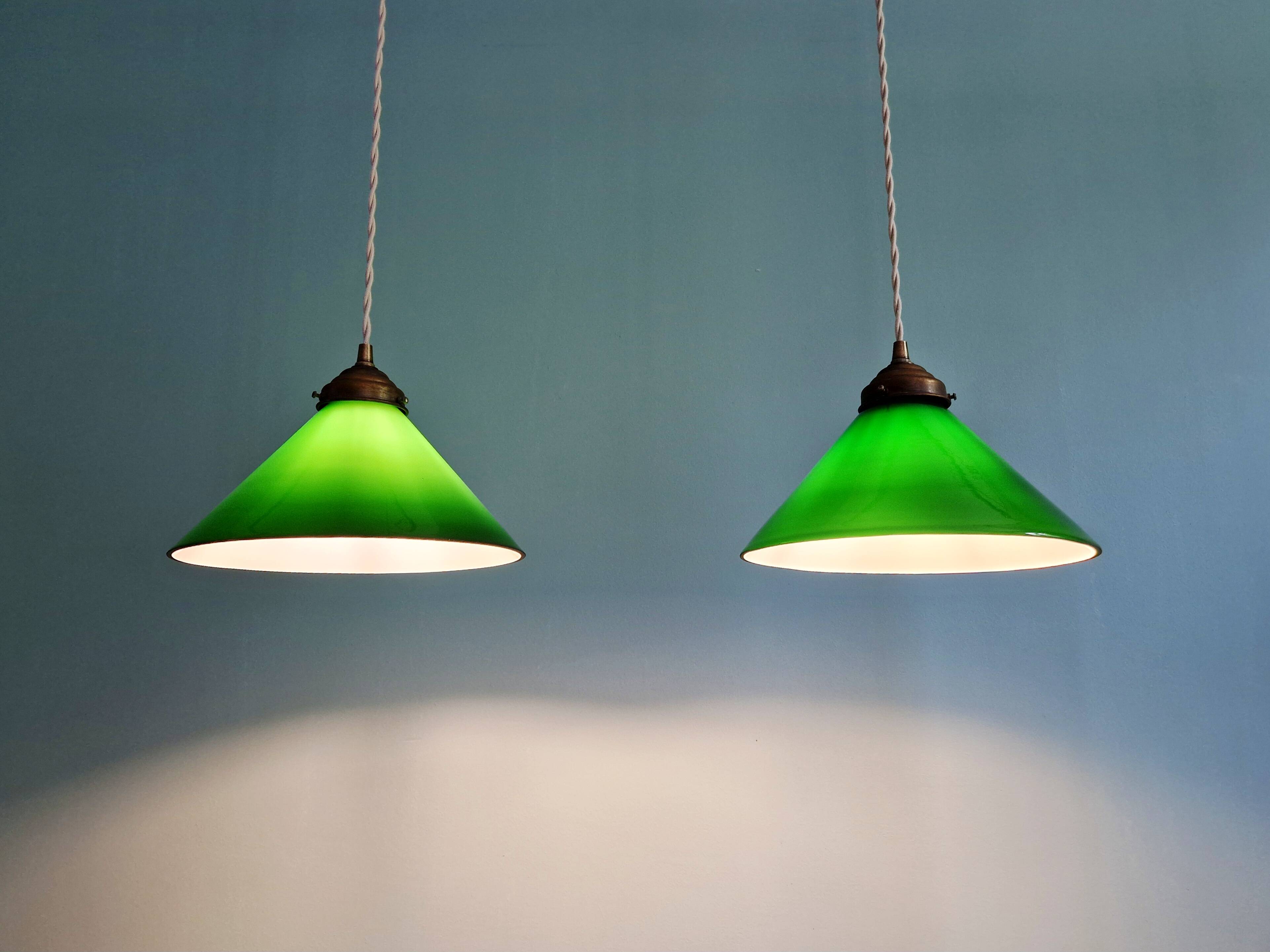 Pair of conical green opaline pendant lights, Art Deco style