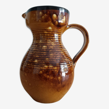 Orange glazed ceramic pitcher