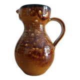 Orange glazed ceramic pitcher