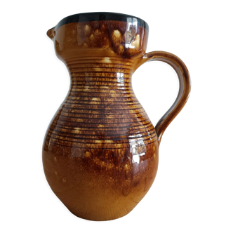 Orange glazed ceramic pitcher