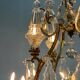 Bronze cage chandelier adorned with cut crystal pendants, 12 lights