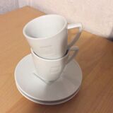 2 coffee cups and saucers