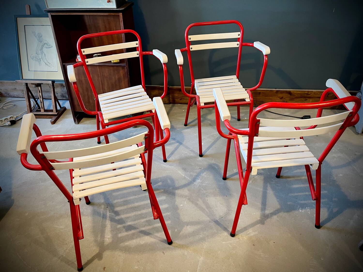 Four TOLIX chairs with armrests