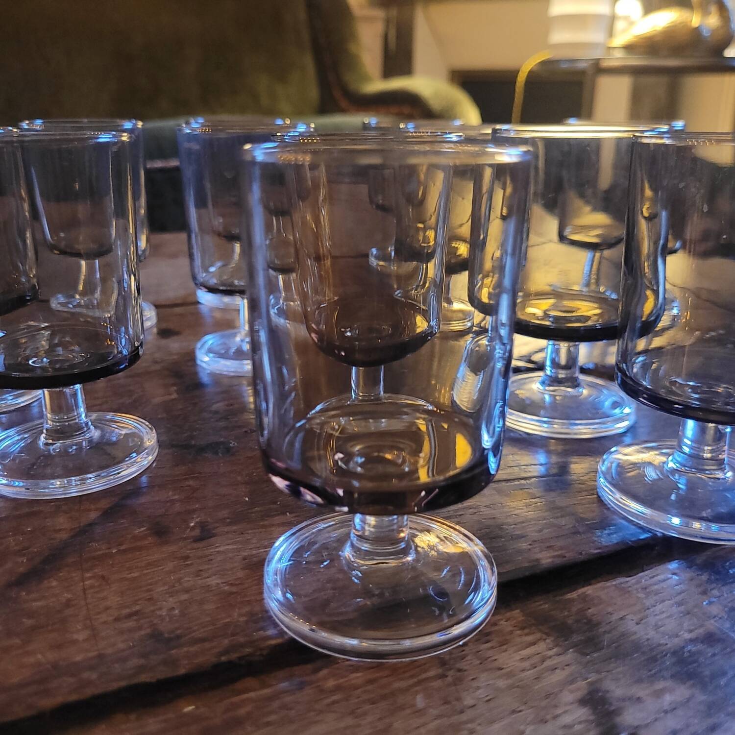 12 smoked glass stemmed glasses from the 70s and 80s.