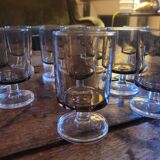 12 smoked glass stemmed glasses from the 70s and 80s.
