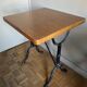 Superb square table made of solid oak from the 1960s, with a cast iron bistro base.