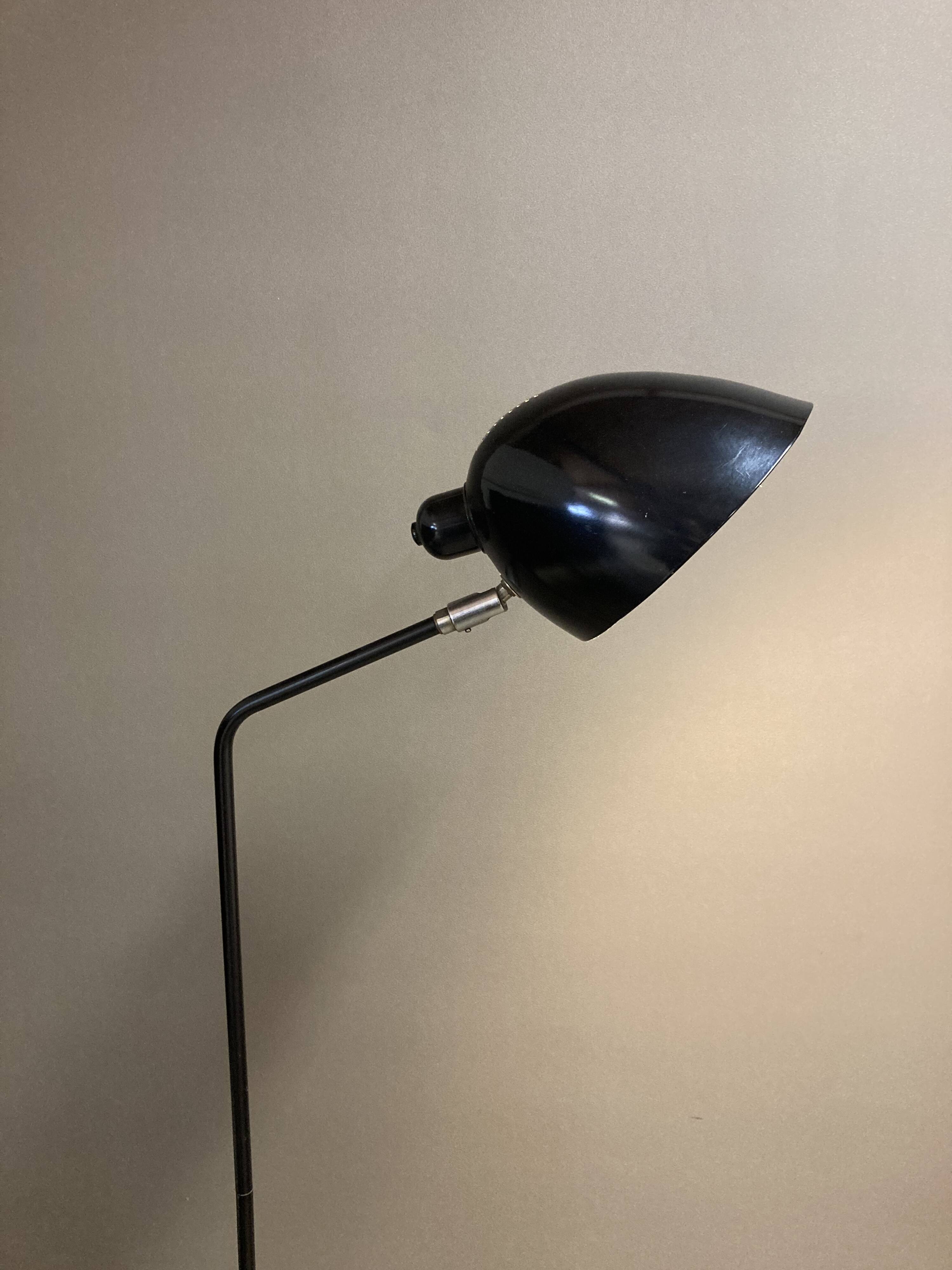 Black metal tripod floor lamp