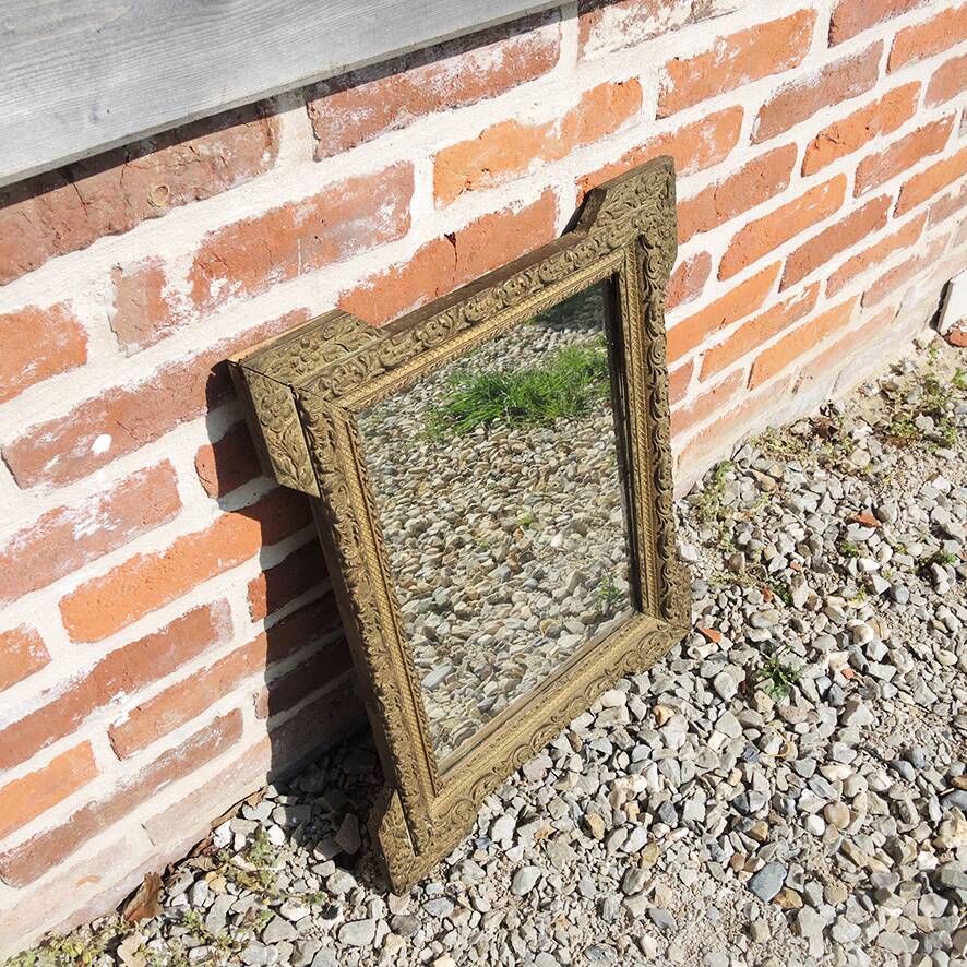 Old wooden and gilded stucco mirror