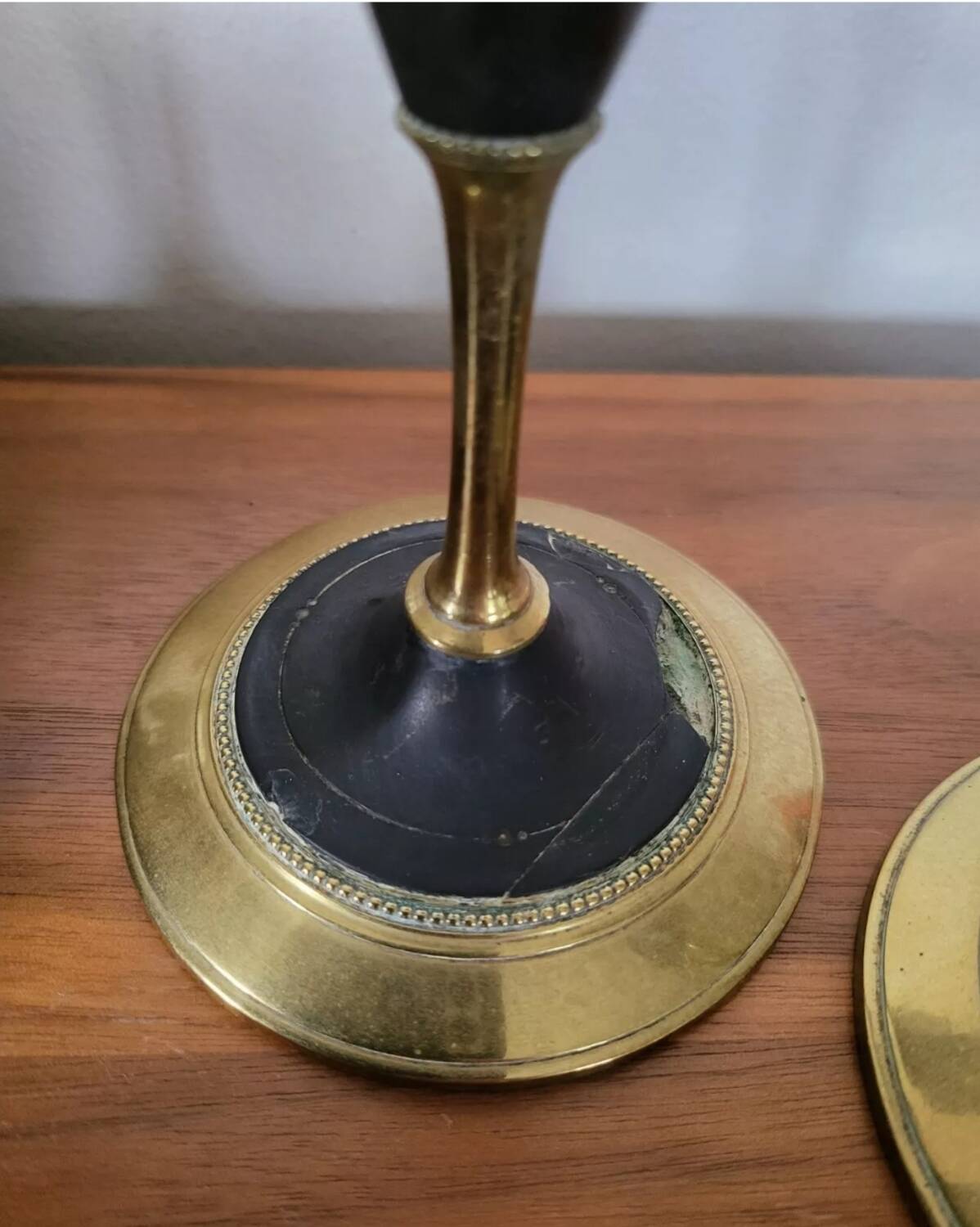 Pair of brass and black hard stone candlesticks