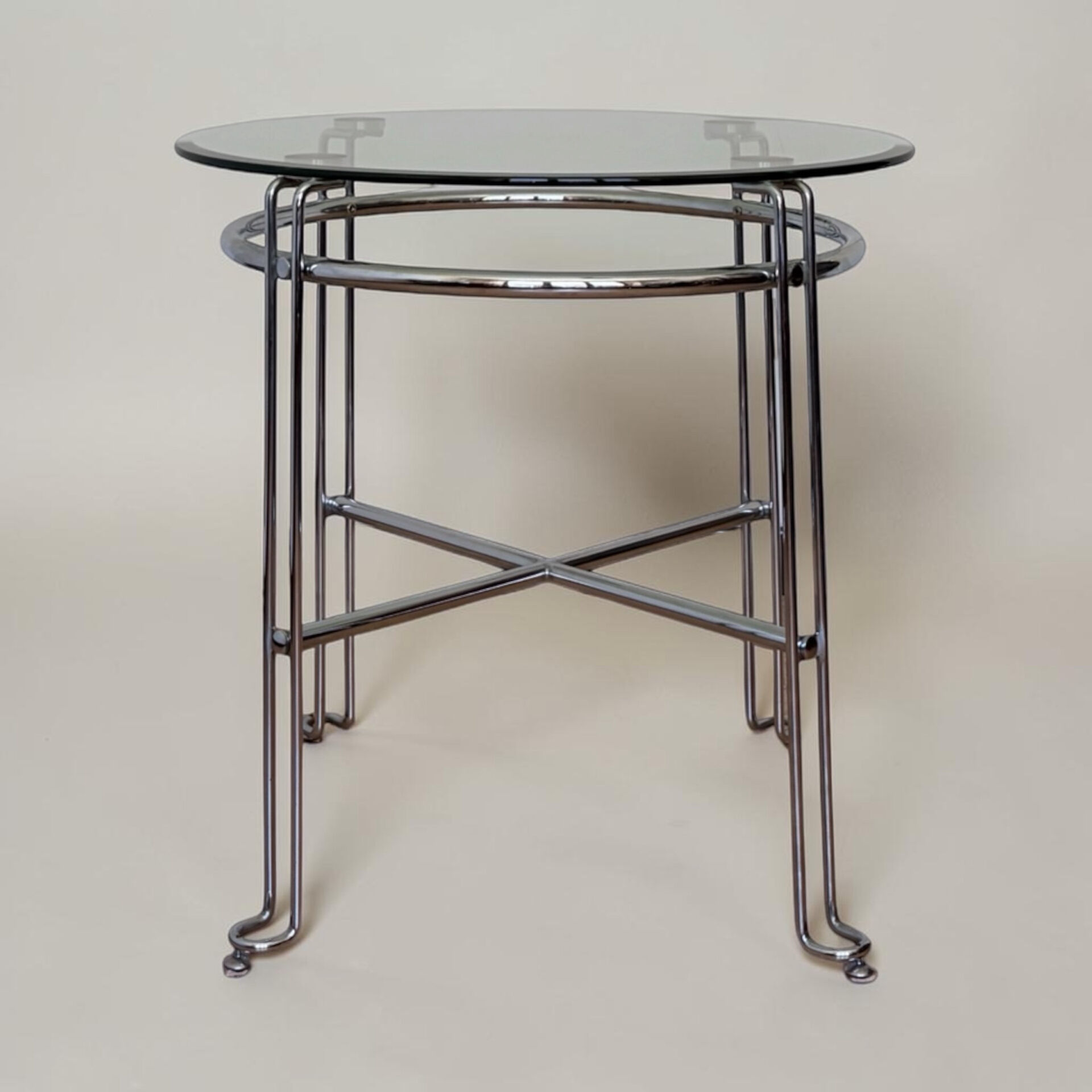 Chrome metal and glass tubular table