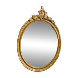Golden oval mirror