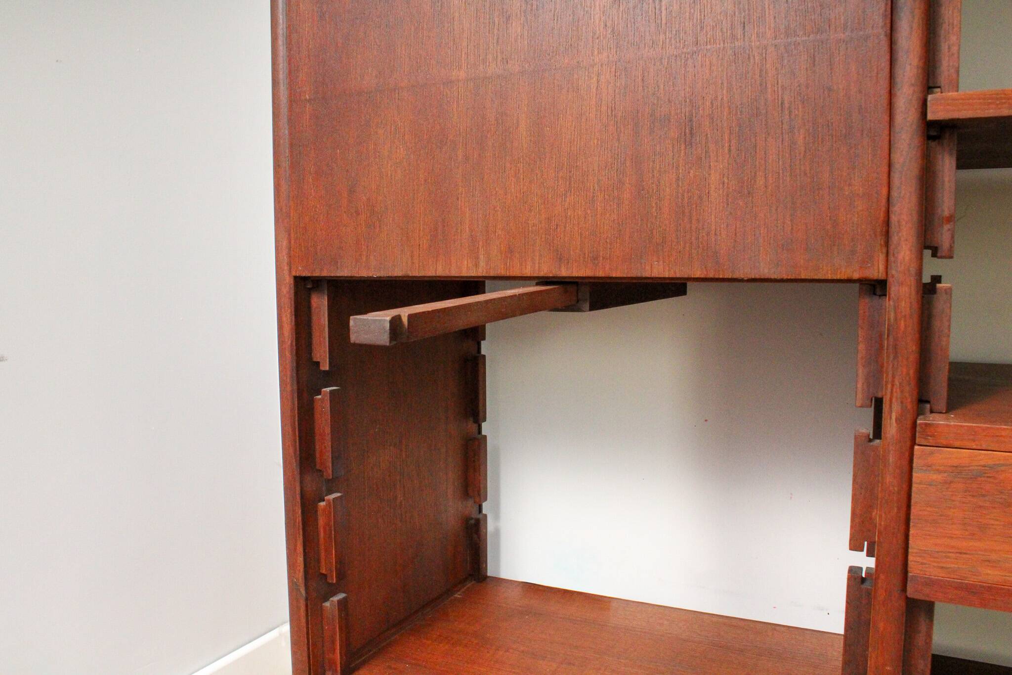A vintage mid-century teak Gianfranco Frattini style bookcase room divider