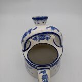 Earthenware watering can vase with floral decoration. St Clement.