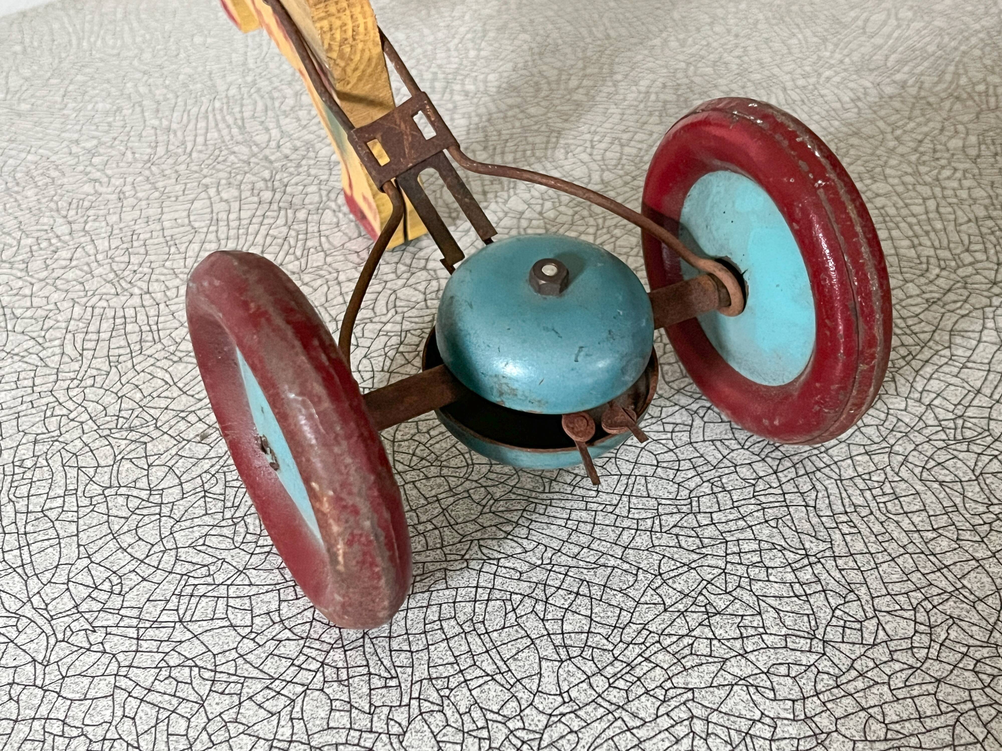 Vintage pull-along toy, horse-drawn with a bell, musical toy