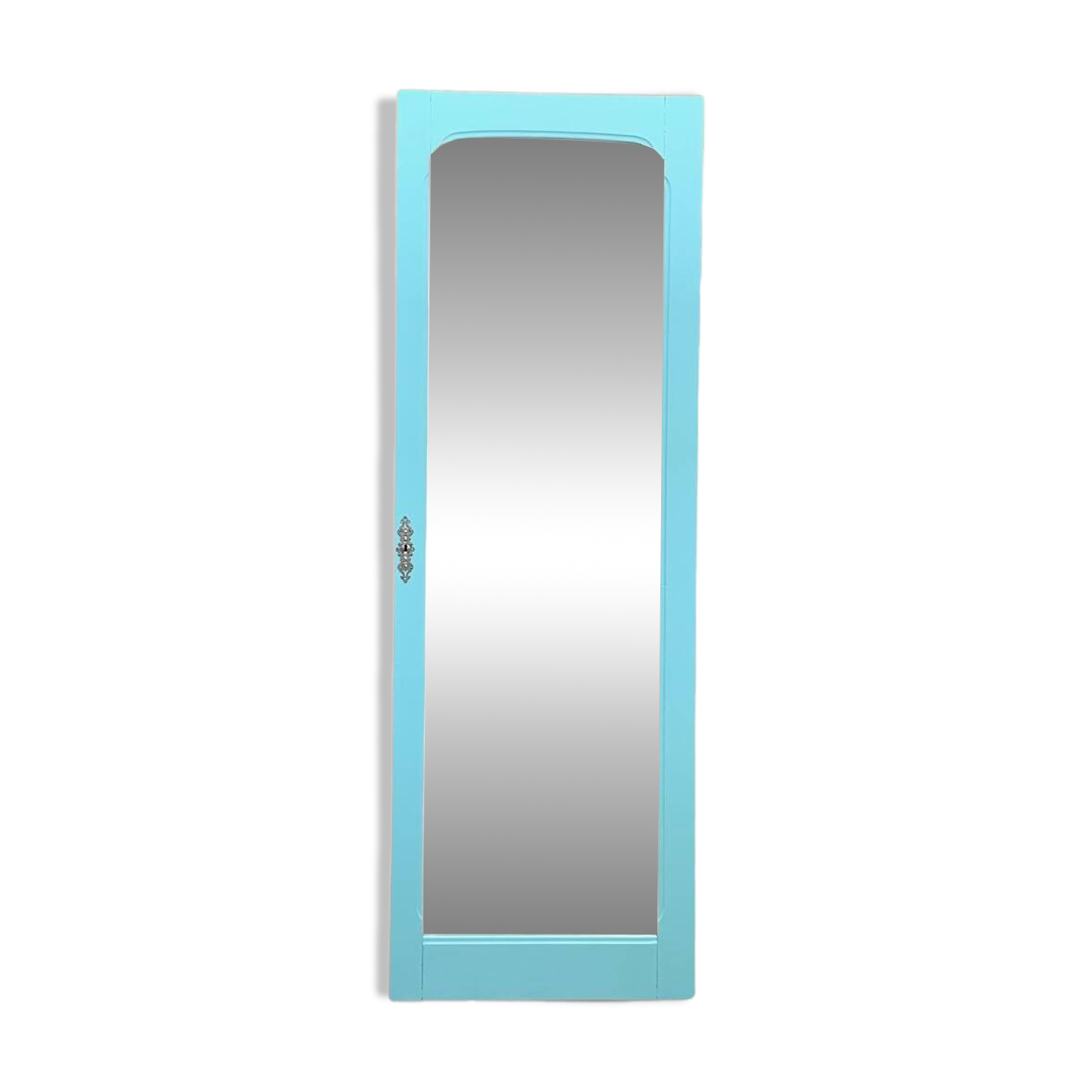 Beveled mirror on turquoise Parisian door