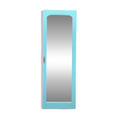 Miroir biseauté sur porte parisienne turquoise