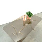 Smoked glass coffee table with gold-coloured legs from Sweden