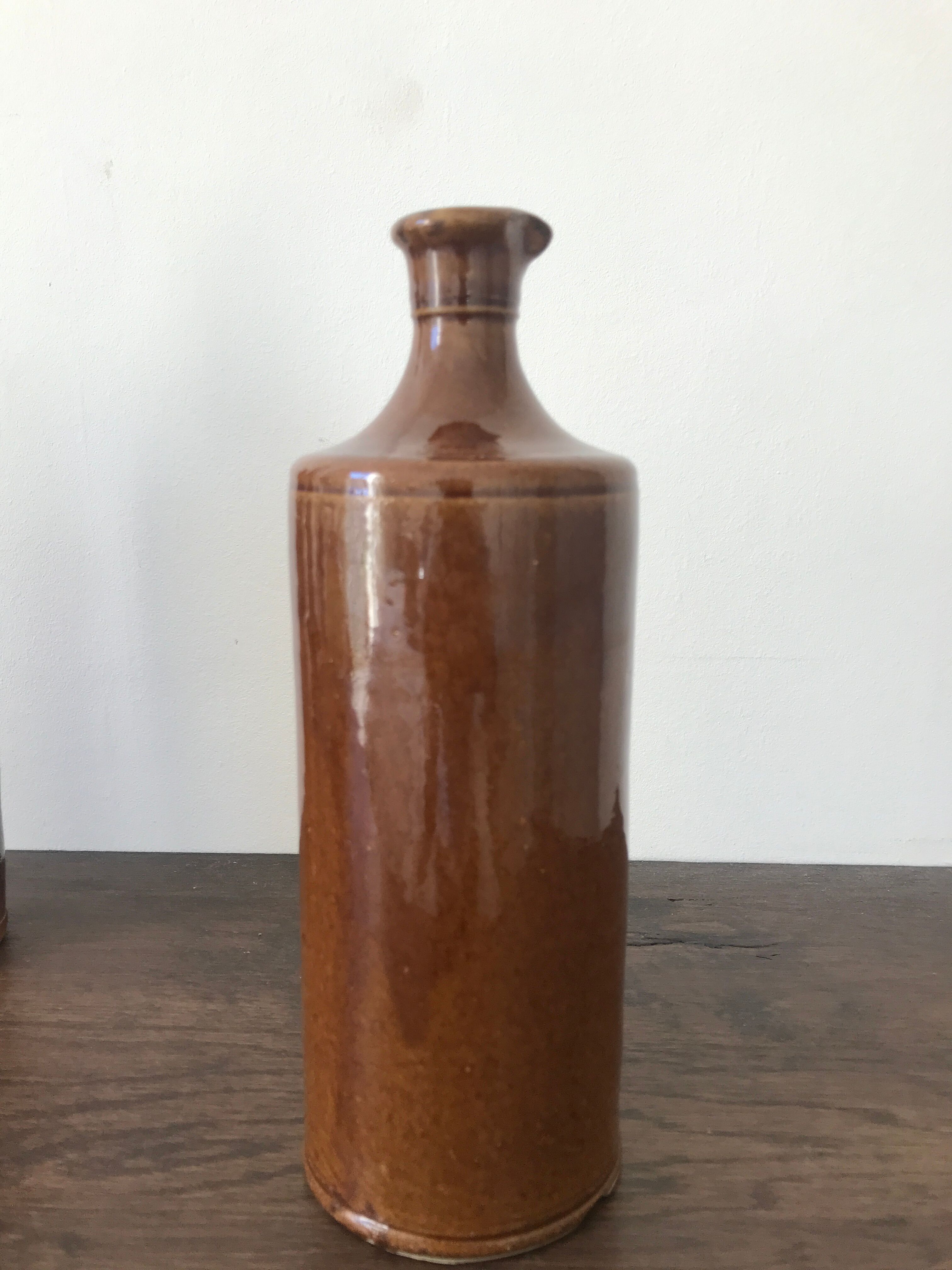 Pair of sandstone bottles