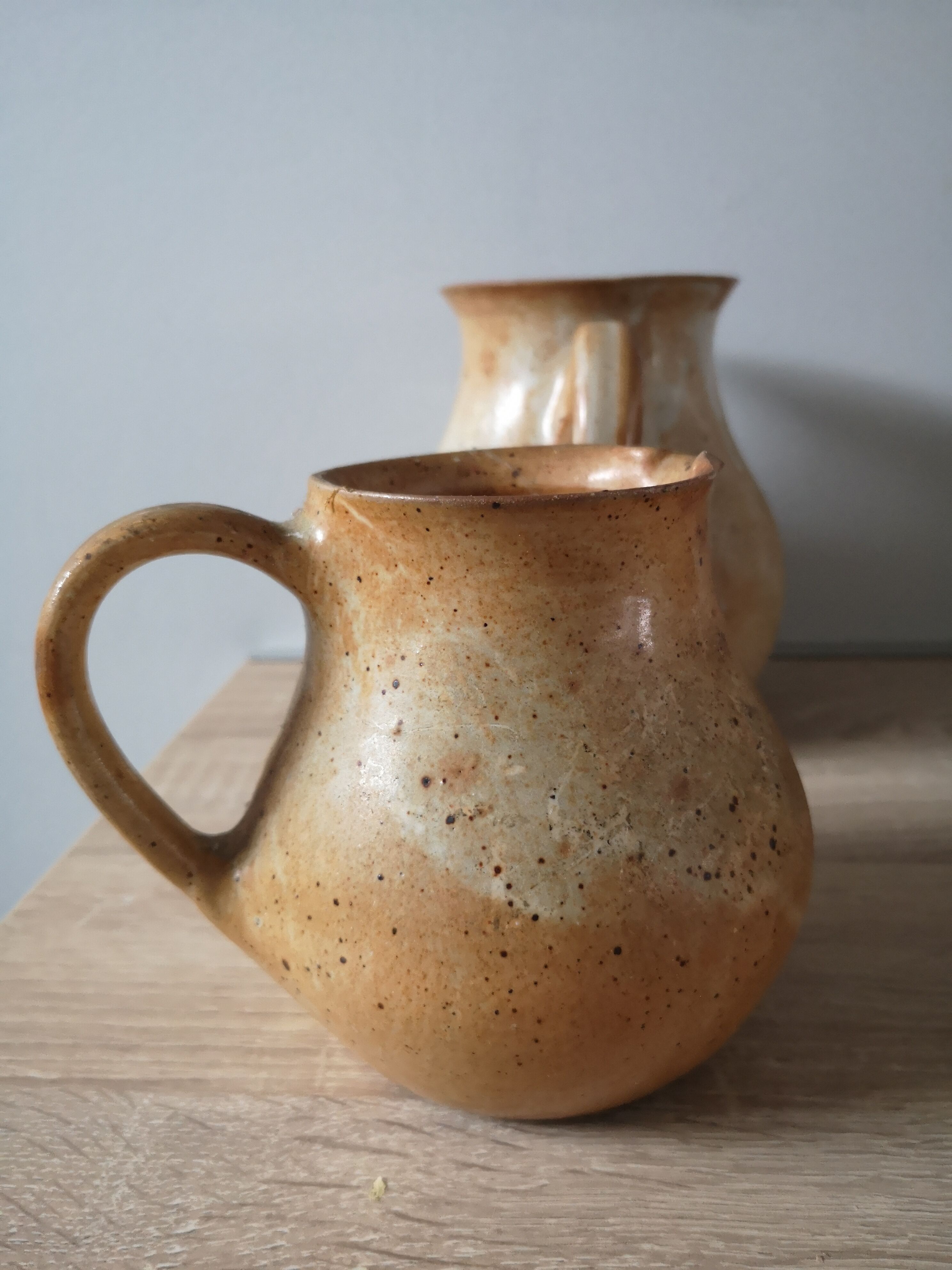 Lot of 4 pitchers in sandstone