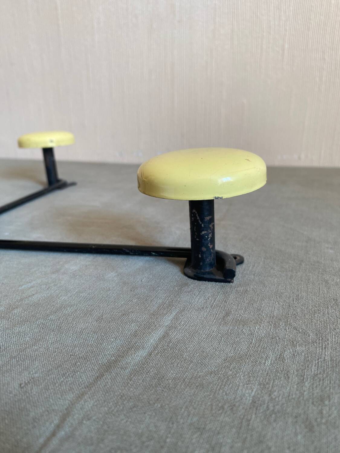 2 black and yellow metal wall coat racks