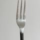 Set of 4 hammered metal cutlery with snail pattern.