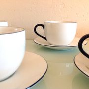 Set of eight white porcelain cups with blue edging / vintage 70s-80s