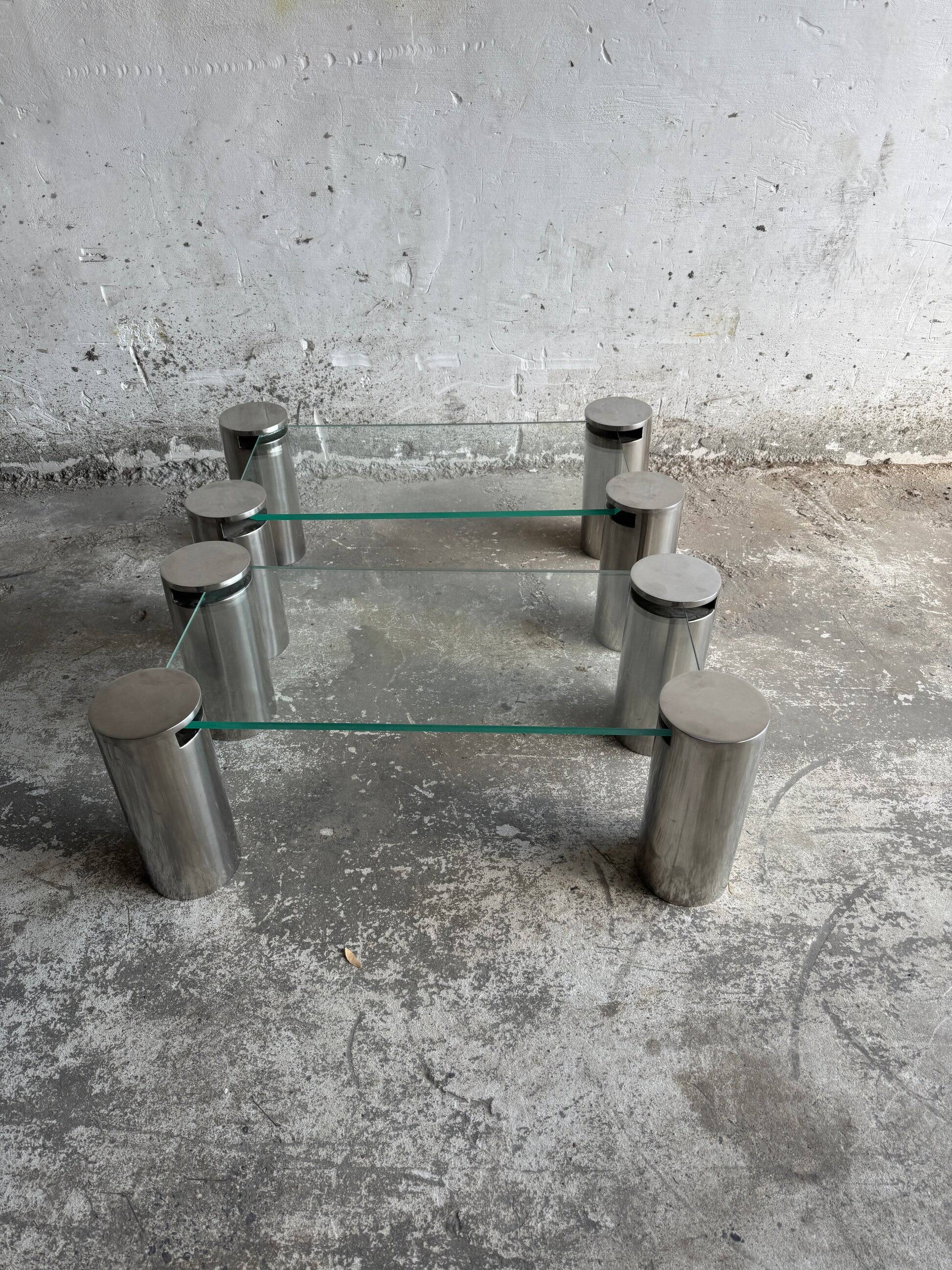 Pair of modernist coffee tables with cylindrical steel legs