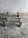 Pair of modernist coffee tables with cylindrical steel legs