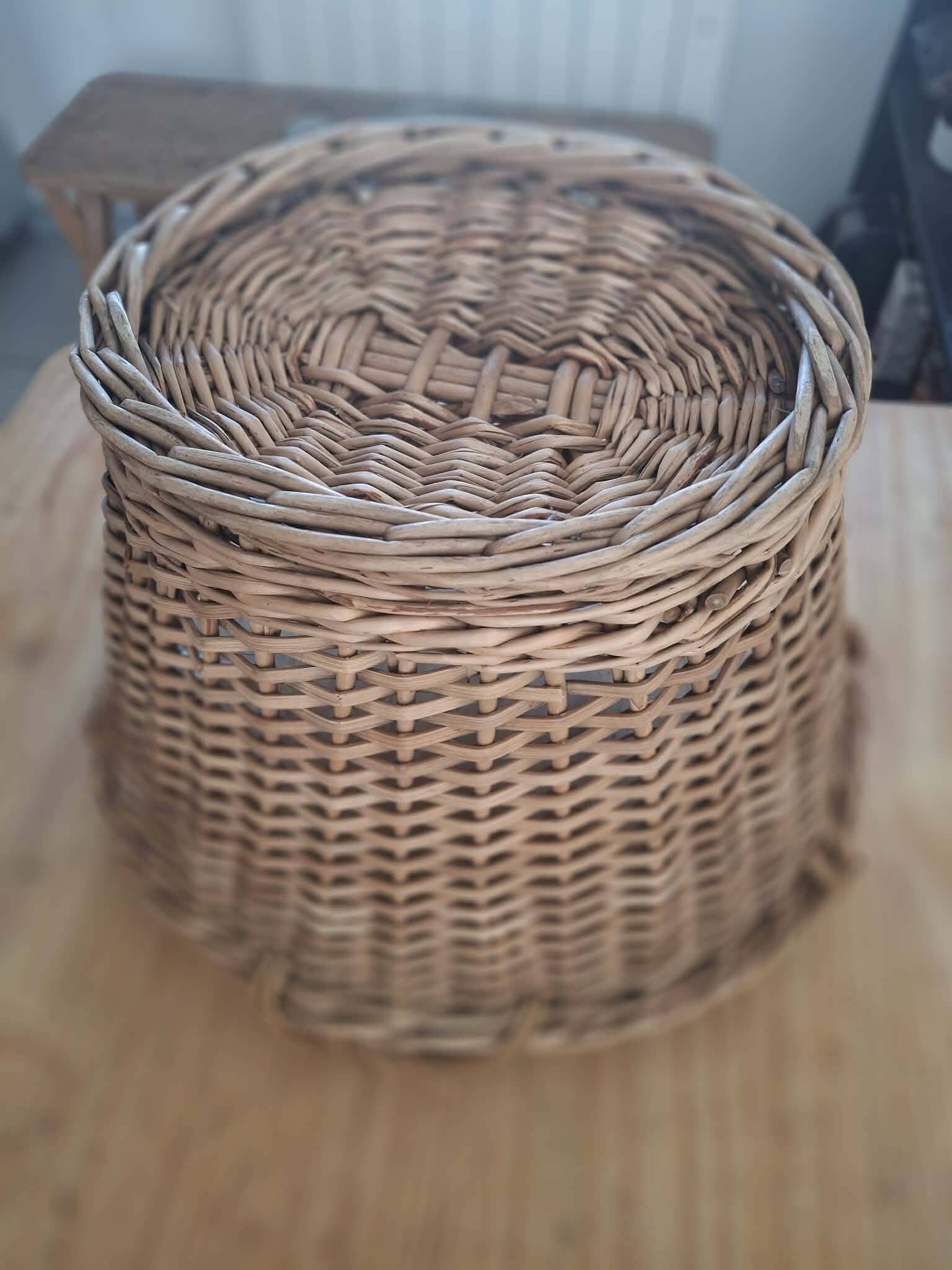 Old wicker basket with 3 handles.
