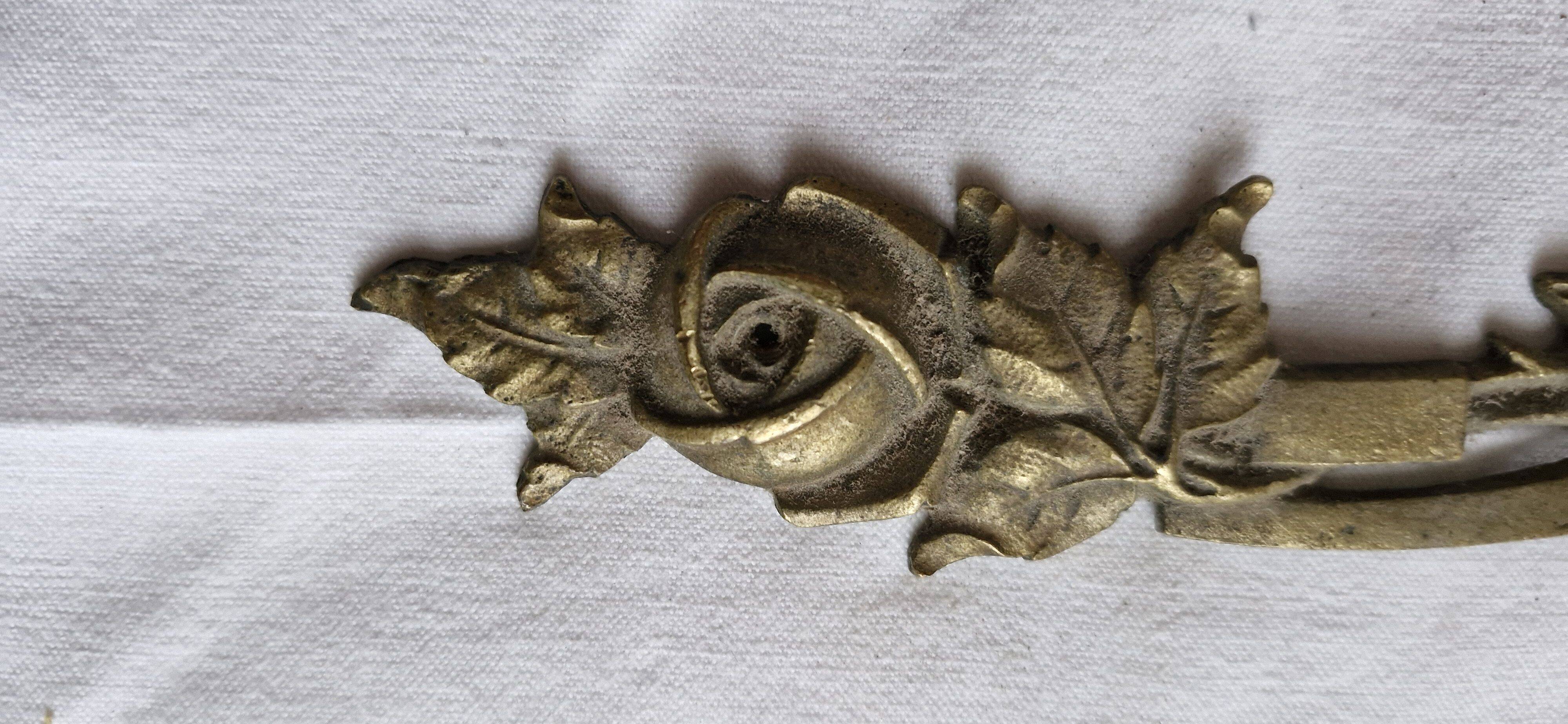 Old brass rose window, width 38cm.