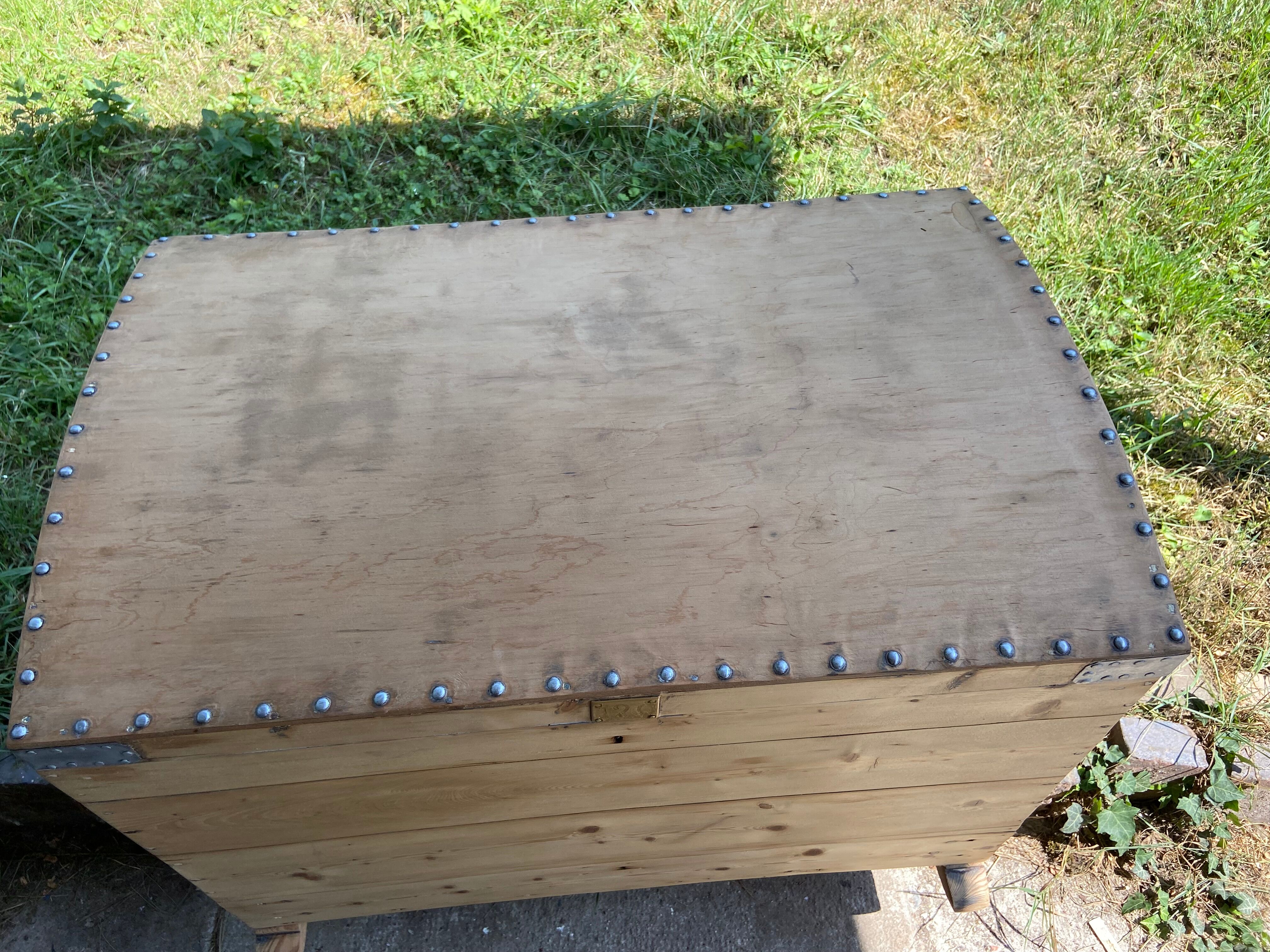 Raw wooden chest with a secret drawer
