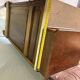 Antique carved wooden dressing table with marble and tilting oval mirror.