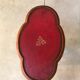 Wooden pedestal table red leather top