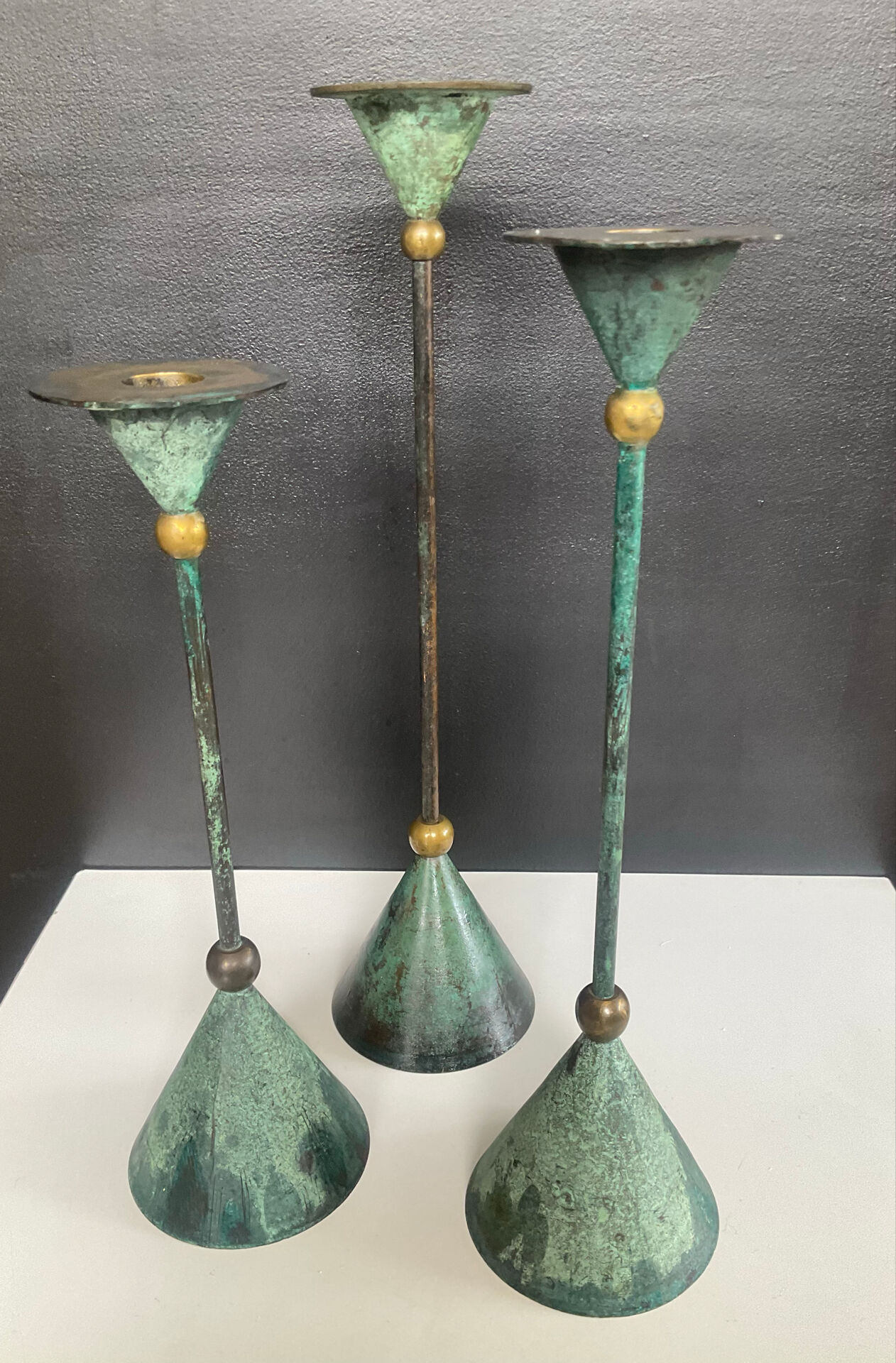 Postmodern metal candlestick trio