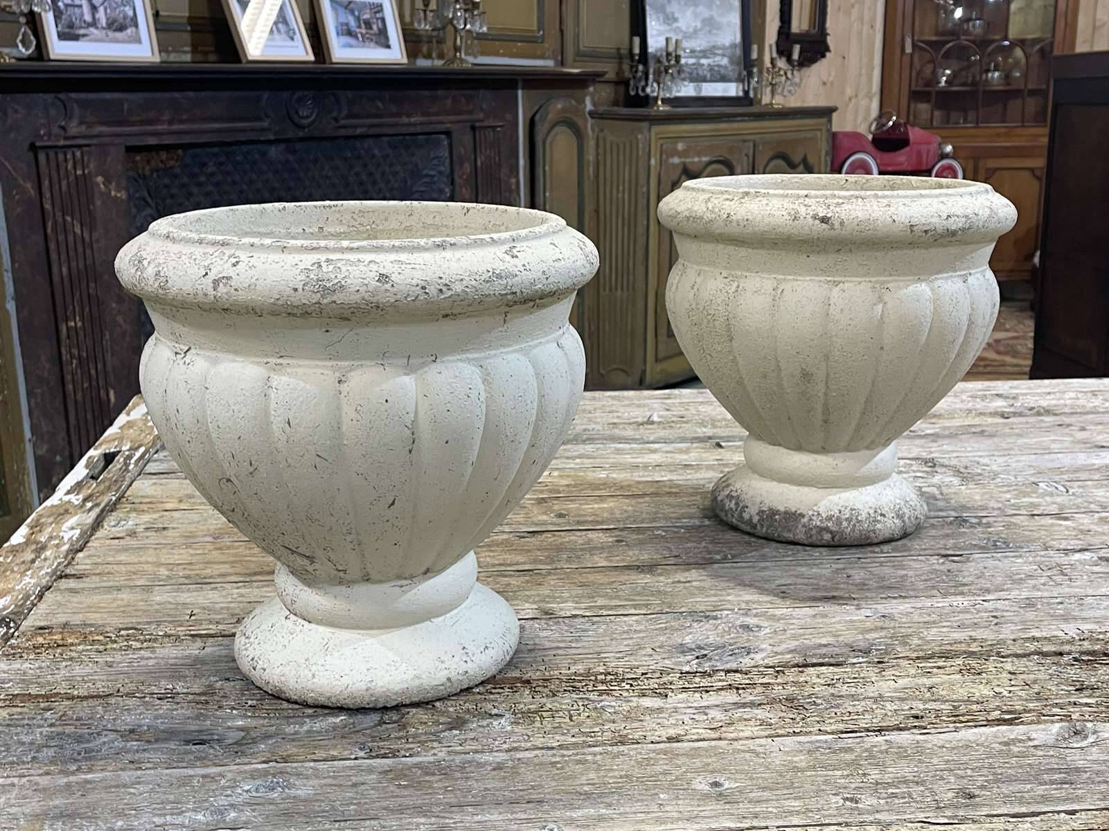 Pair of reconstituted stone planters from the 1970s.