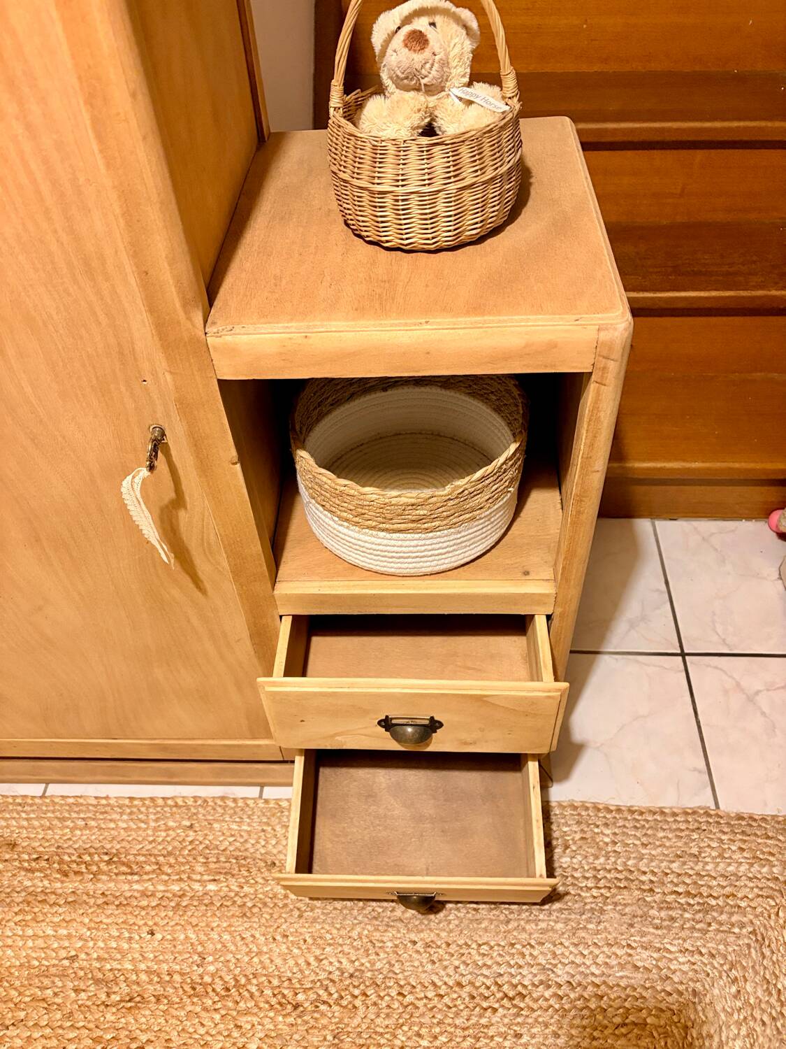 Asymmetrical cabinet made of raw wood