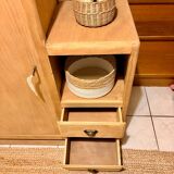 Asymmetrical cabinet made of raw wood