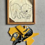 Wooden frame puzzle from the 1940s/50s depicting a cat on a yellow background.