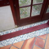 Low bench rests feet in patinated wood