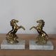 Pair of vintage bookends with rearing horses in gilded metal on marble bases.