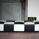 Roche Bobois black and white checkered leather bench, low bench.