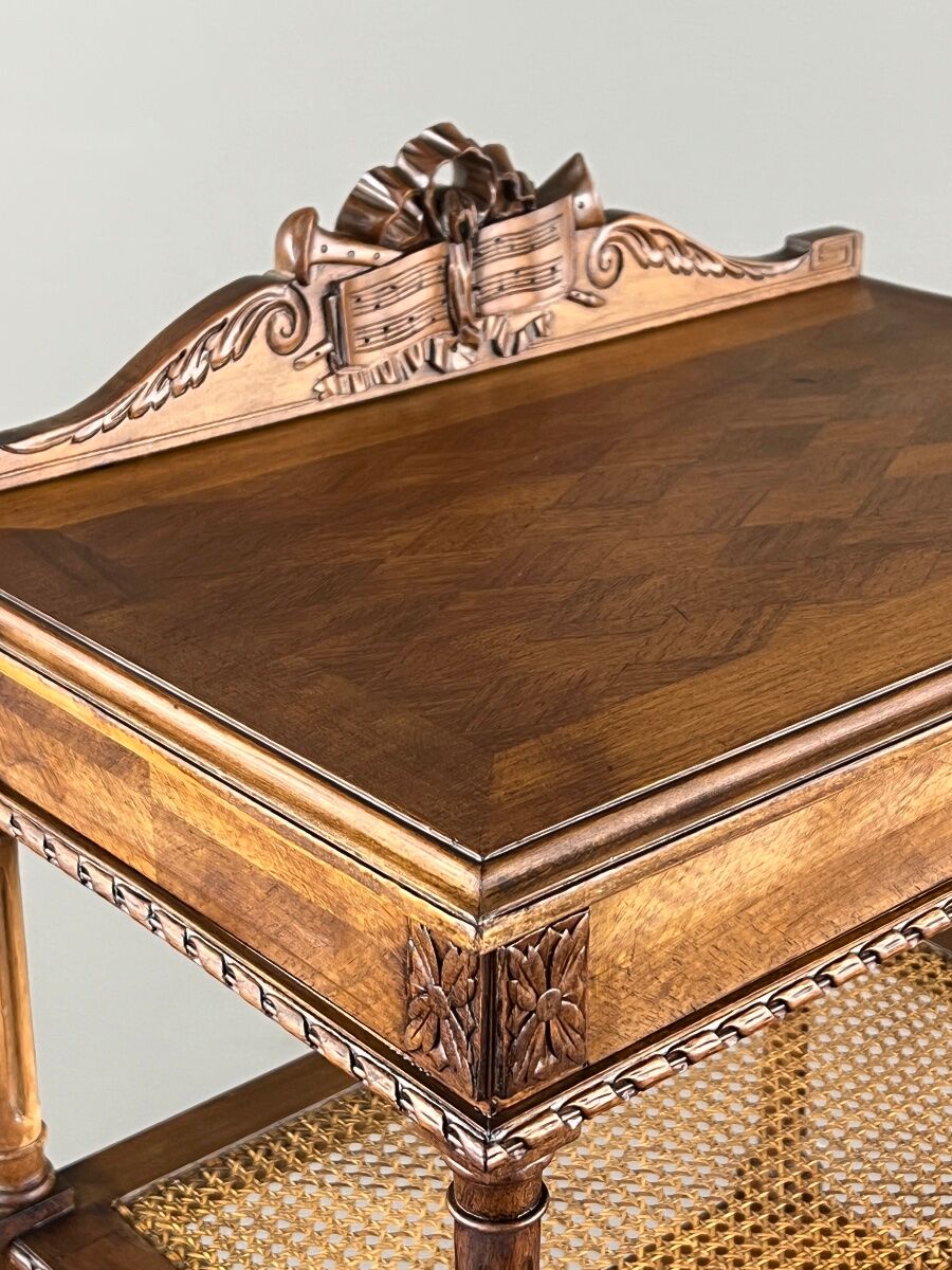 Louis XVI style music cabinet in carved wood with caning, 19th century.