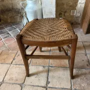 Campaign stool in rattan and wood