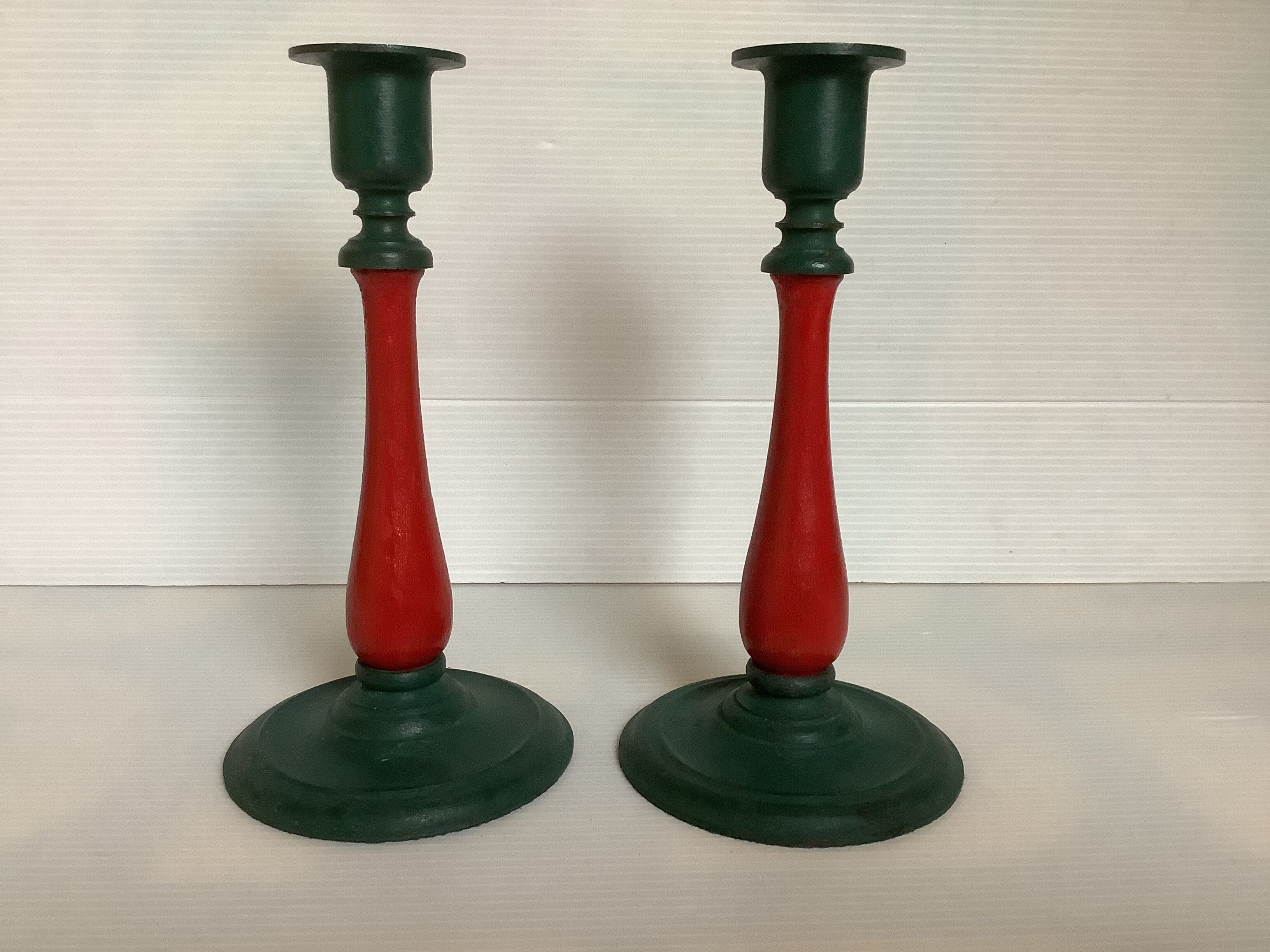 Pair of cast iron and wood candle holders