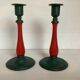Pair of candlesticks in cast iron and wood