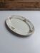 Oval plate Sarreguemines cream with pink gilding, antique.