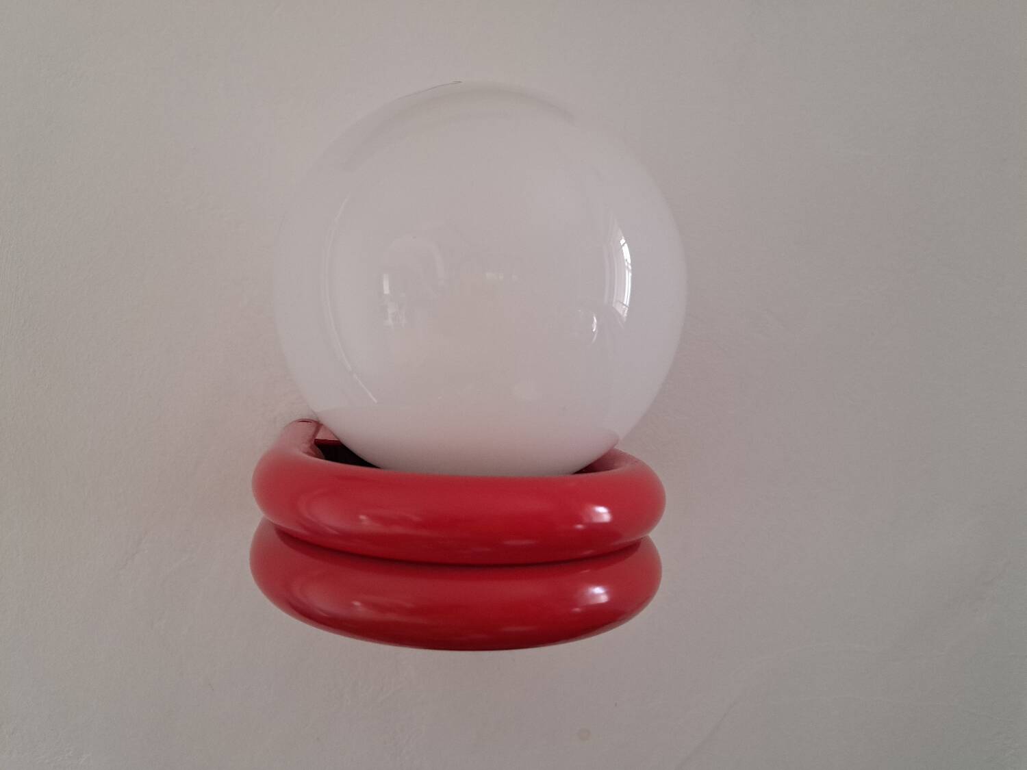 Red metal globe wall light