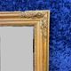 Empire period mirror in wood and gilded stucco circa 1810-1820