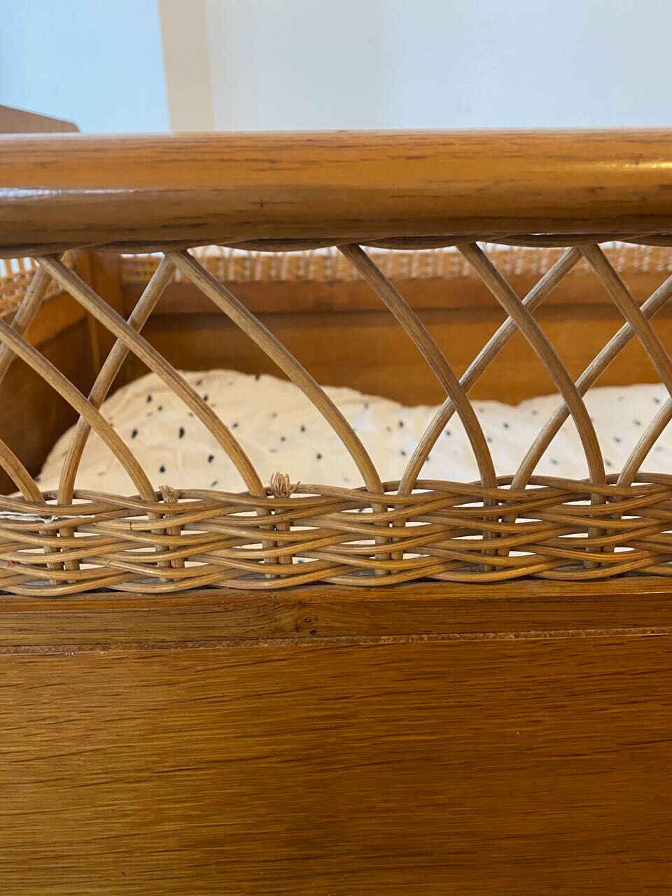 Wooden and wicker baby bed