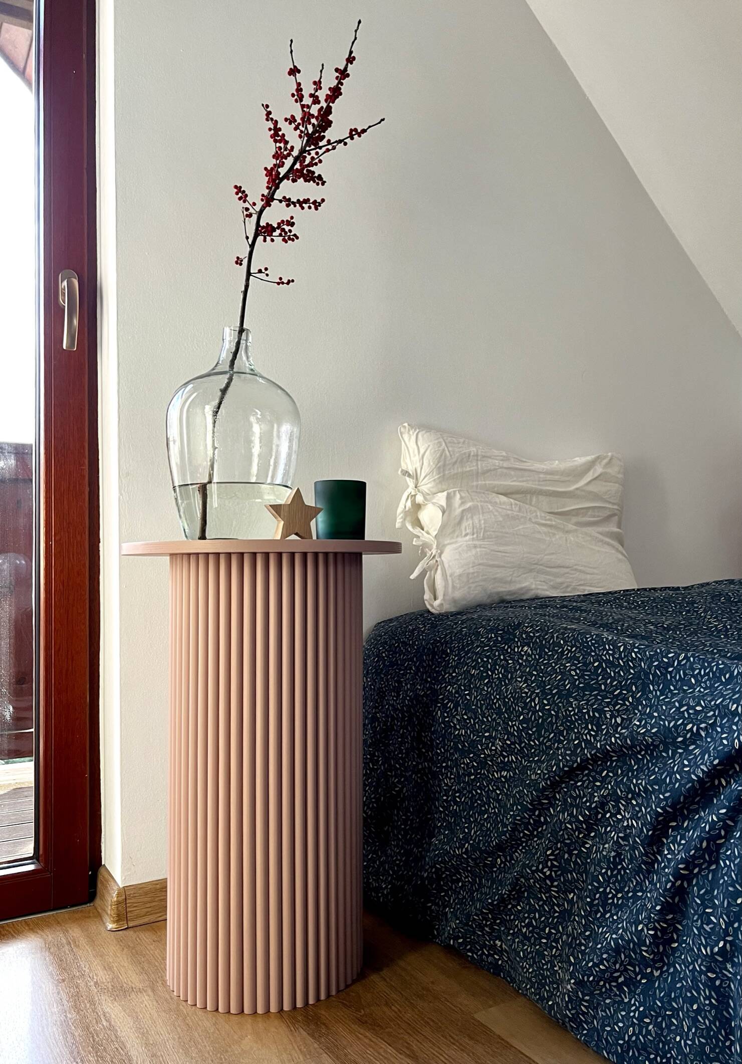 round and fluted bedside table in dusty pink